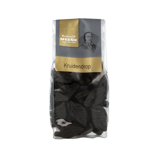 Meenk Kruidendrop snoepgoed in a 180g package, colorful herbal drops with branding and shiny wrapper visible in the image.
