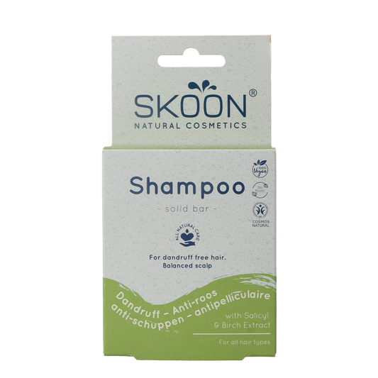 Skoon solid anti-dandruff shampoo bar in 90g, natural hair care product with a minimalist design and packaging.