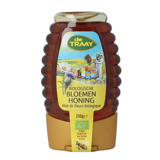 De Traay Bloemenhoning knijpfles bio 250g jar showing golden honey inside, with a clear squeeze bottle for easy dispensing.