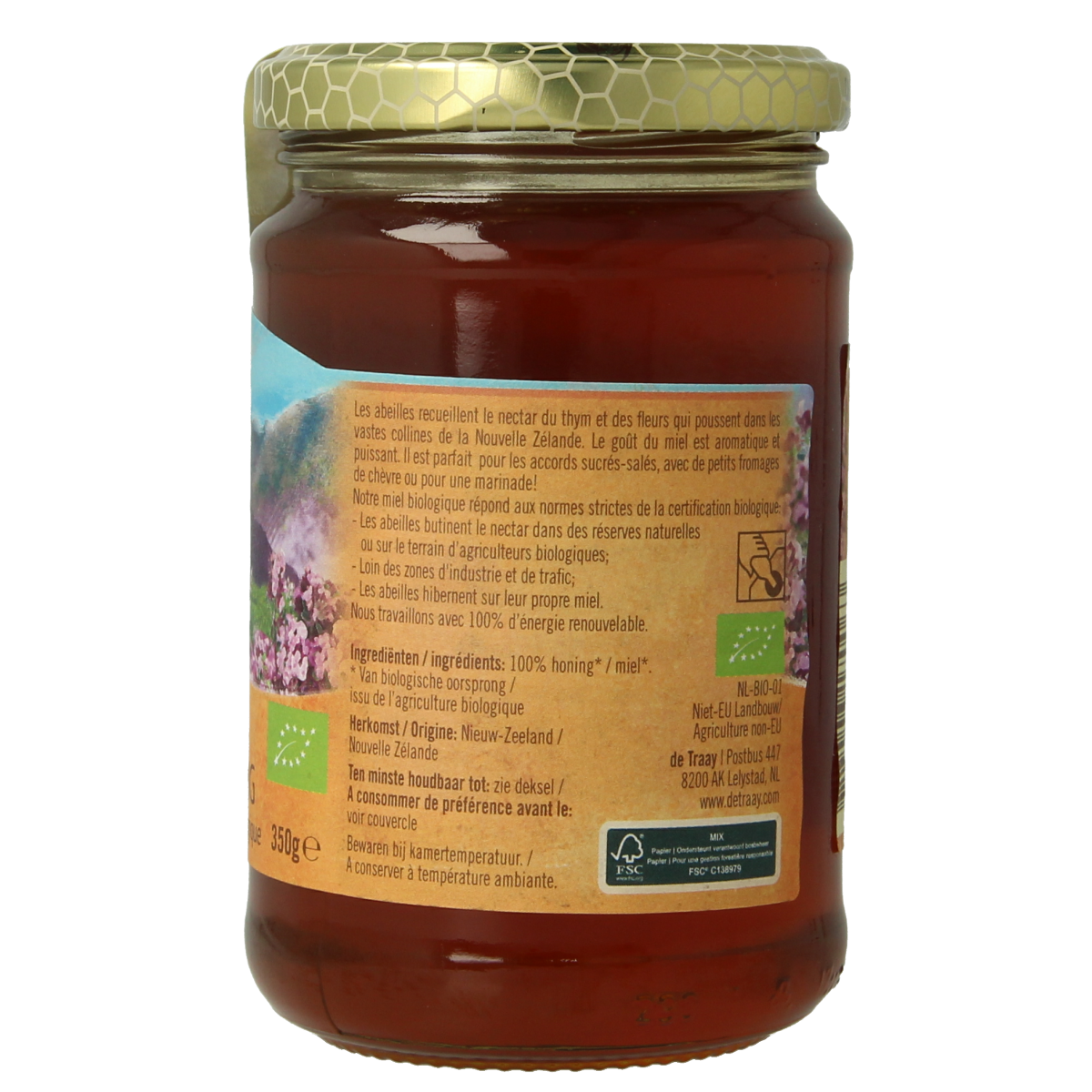 De Traay biologische tijmhoning met bloemenhoning in 350g pot, showcasing golden honey with floral infusion.
