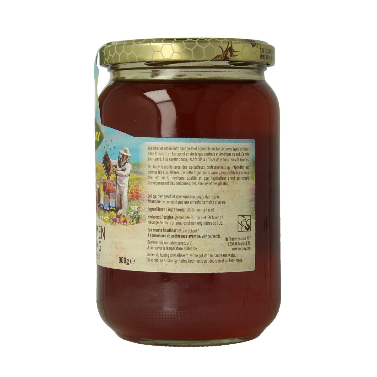 Liquid de Traay flower honey jar showing golden honey in a clear glass container, 900 grams.