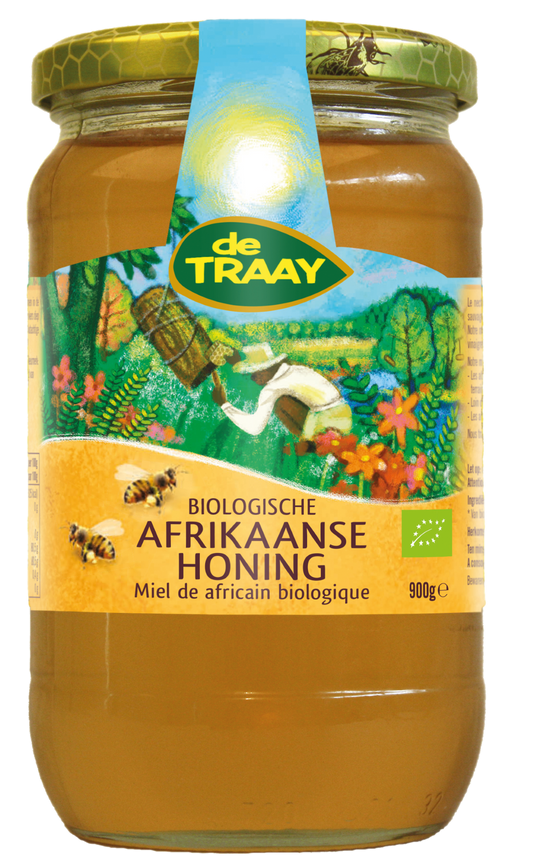Jar of de Traay organic African honey in a 900g glass container with a golden honey inside.