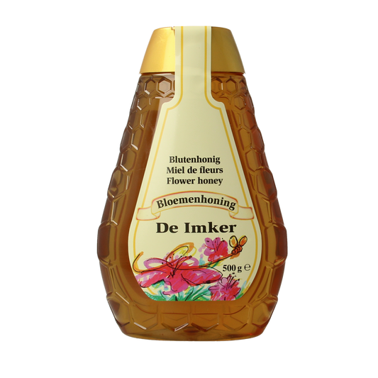 De Imker Bloemenhoning in 500g knijpfles, natural honey from bees, with a clear squeeze bottle and golden color.