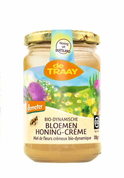De Traay organic biodynamic flower honey in a 350g jar, showcasing the golden honey with floral notes and natural texture.