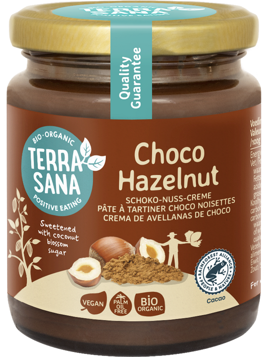 Organic TerraSana Choco Hazelnut Spread on bread, showing a jar with chocolate hazelnut spread and a slice of bread with spread.