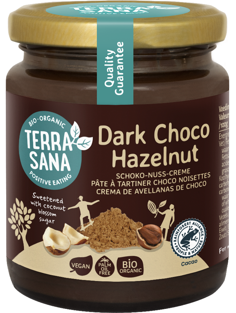 TerraSana Choco Hazelnootpasta puur bio spread on bread, showing smooth chocolate and hazelnut spread in a jar.