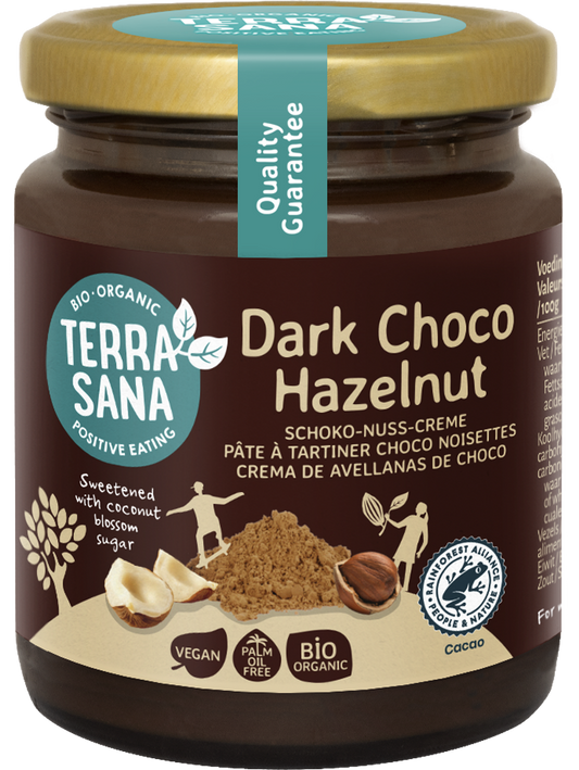 TerraSana Choco Hazelnootpasta puur bio spread on bread, showing smooth chocolate and hazelnut spread in a jar.