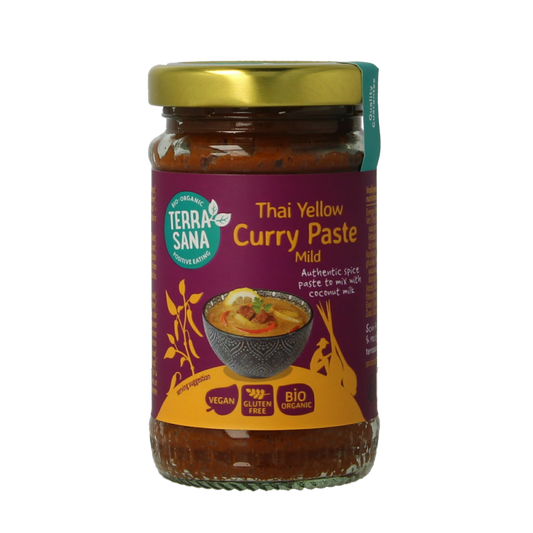 Organic TerraSana Thai yellow curry paste in a 120g jar, featuring a vibrant yellow color and fresh herbal ingredients.
