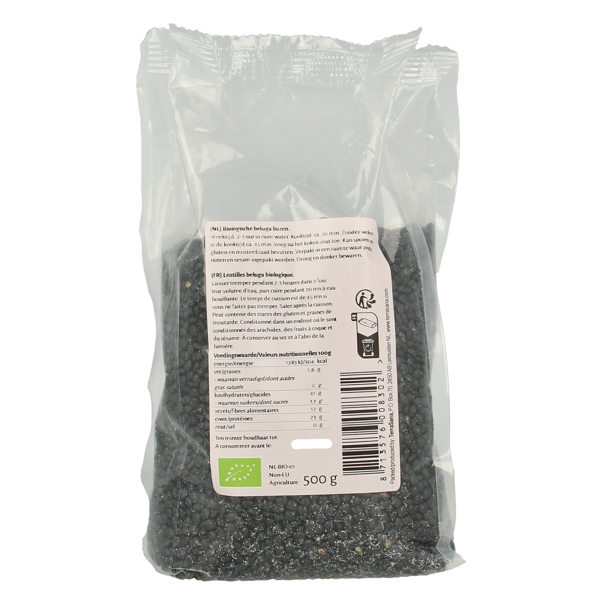 Organic TerraSana Beluga lentils in 500g package, displayed with fresh vegetables and potatoes in a natural setting.