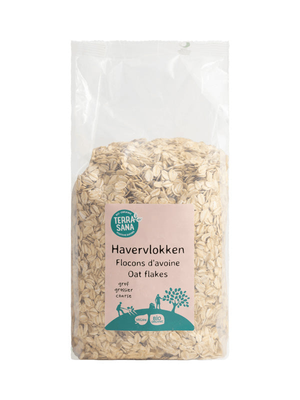 TerraSana Grof Bio Havervlokken ontbijdtgran, 750g, in een open kom met havervlokken en een lepel, natuurlijke uitstraling