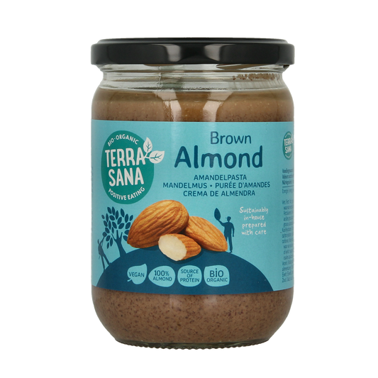 Organic TerraSana almond spread on bread, 500g jar, natural almond-based bread topping with a smooth texture.