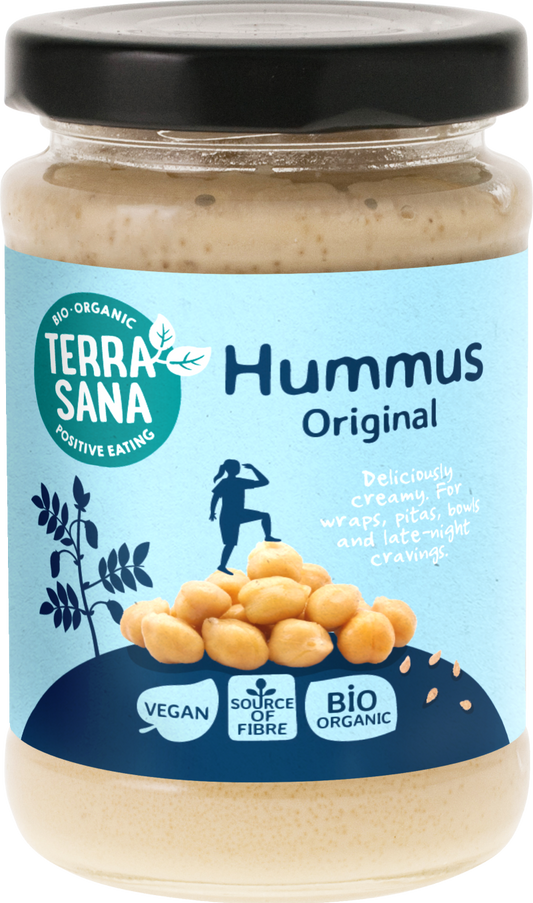 TerraSana organic hummus original 190g spread on bread, showcasing creamy texture and fresh ingredients in a jar.