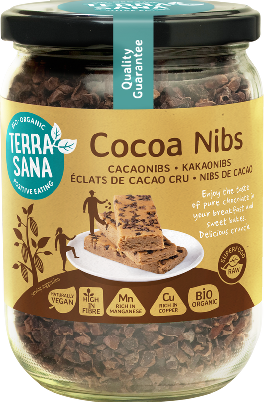 TerraSana Raw cacao nibs in glass jar, organic superfood, 230 grams, showing cacao nibs in clear glass container.