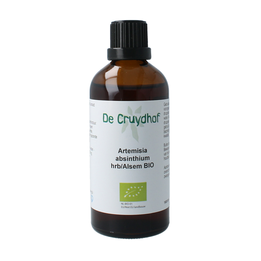 Cruydhof Artemisia absinthium bio tinctuur in a 100ml bottle, herbal preparation with fresh green leaves and herbal label.