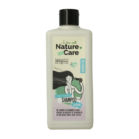 Nature Care Shampoo for hair, 500ml, nourishing haircare product with natural ingredients, in a clear bottle.