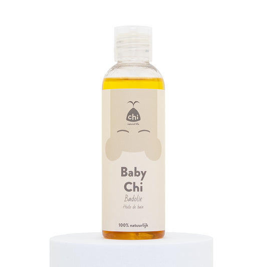 Chi Baby Chi badolie 100ml bottle, gentle baby and toddler care oil, clear container showing the light yellow oil inside.
