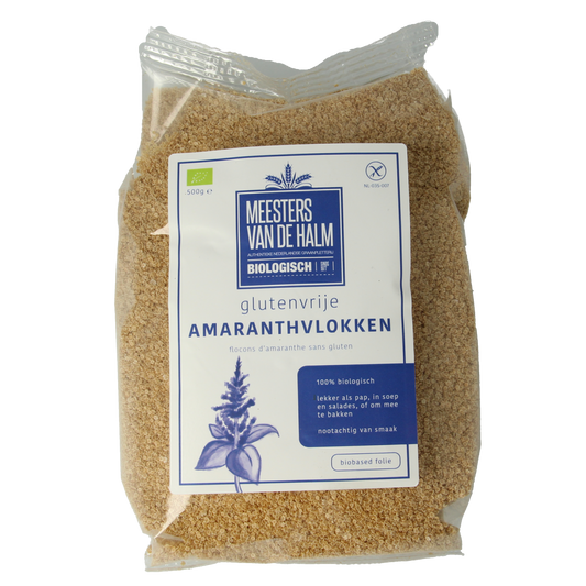 Organic De Halm Amaranth flakes in a 500g package, shown in a clear bowl with some flakes scattered around.