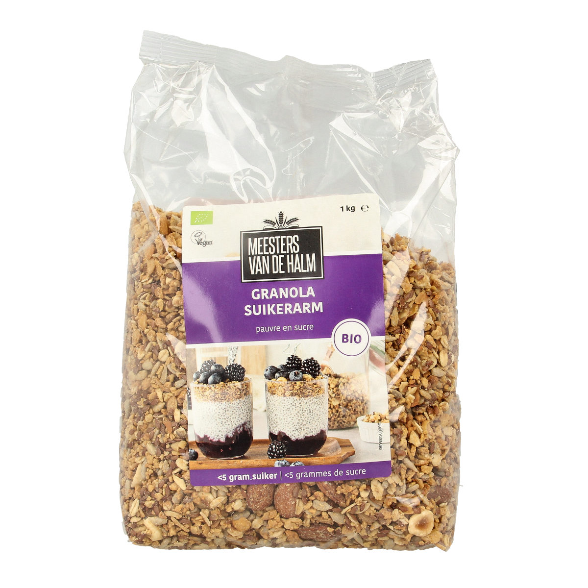 De Halm suikerarme biologische granola ontbijtgranen in 1 kg verpakking, shown in a clear bowl with crunchy clusters.