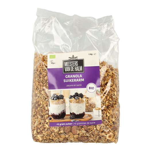 De Halm suikerarme biologische granola ontbijtgranen in 1 kg verpakking, shown in a clear bowl with crunchy clusters.