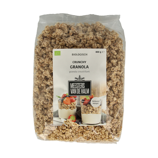 De Halm bio granola breakfast cereal in a clear bowl, showing golden oats and nuts, healthy and natural snack option.