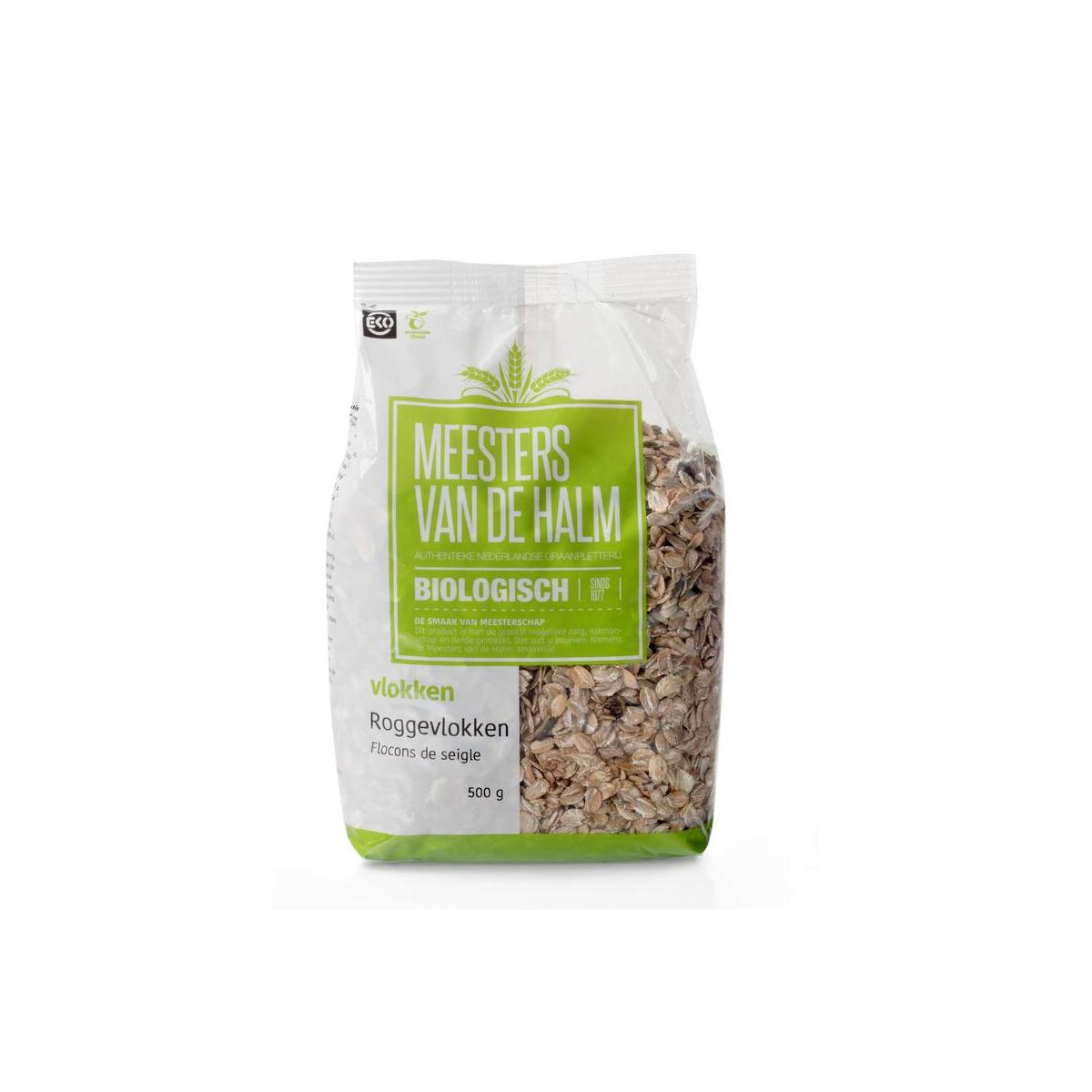 Organic De Halm Roggevlokken breakfast grains in a 500g package, showing a close-up of the toasted rye flakes in a bowl.