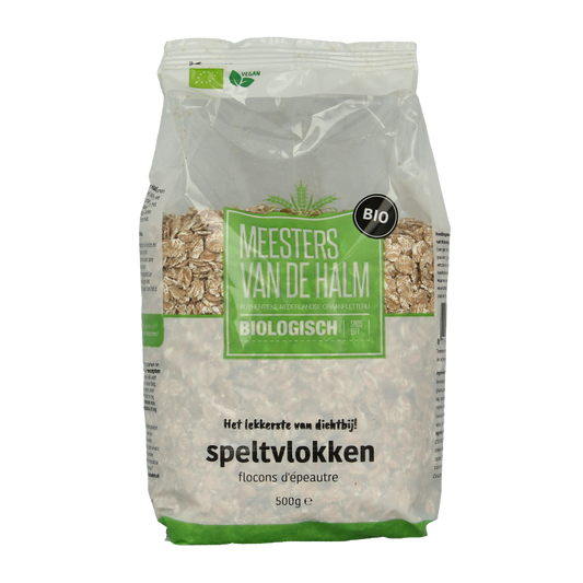 De Halm bio speltvlokken ontbijtgranen in 500g package, showing golden toasted spelt flakes in a clear bowl.