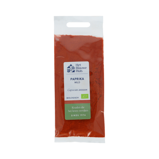 Organic mild paprika powder from Het Blauwe Huis, 30g jar, showing vibrant red spice in a clear glass container.