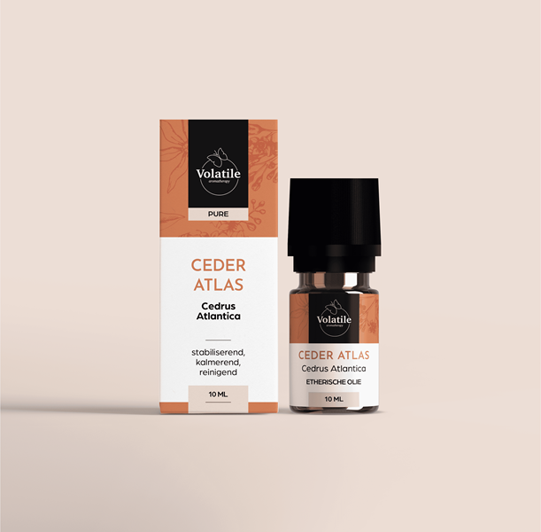 Volatile Cedar Atlas essential oil in a 10ml glass bottle, showcasing clear liquid and label with product details.