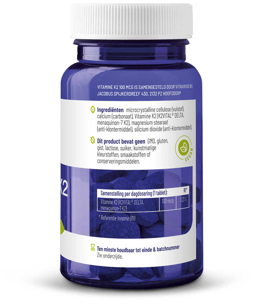 Vitakruid Vitamine K2 100 mcg K2VITAL DELTA tablets, close-up of white supplement tablets on a neutral background.