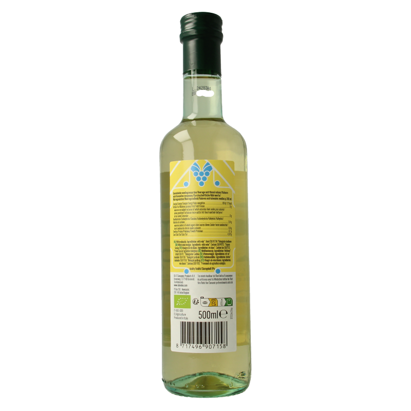 Bioidea organic white wine vinegar bottle, 500ml, with clear label showing product details, in a kitchen setting.