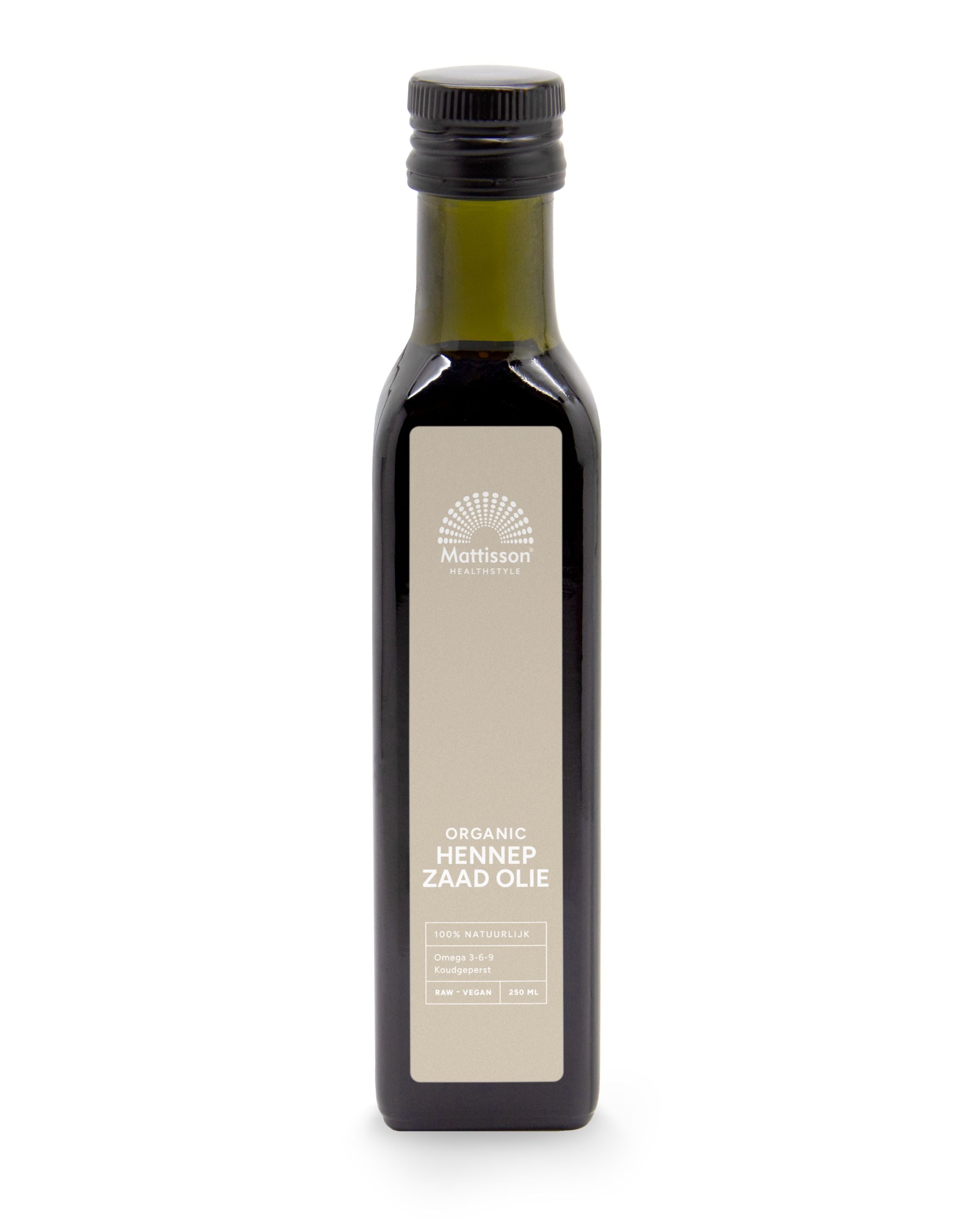 Raw cold-pressed organic hemp seed oil by Mattisson in a 250ml bottle, shown in a clear glass container with hemp seeds nearby.