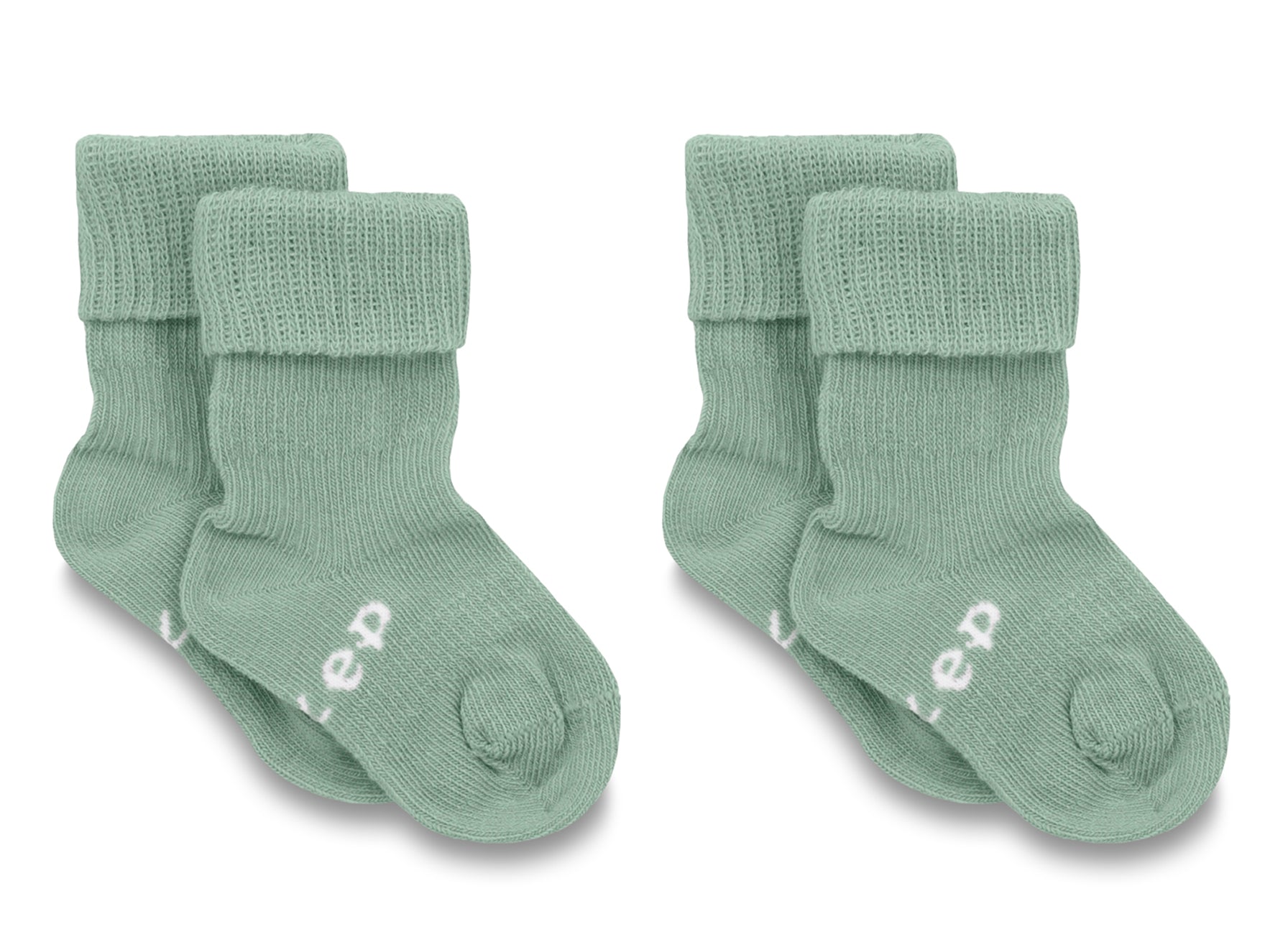 KipKep Blijf baby socks for 0-6 months in pale green, soft cotton, shown in a pair on a baby’s feet.