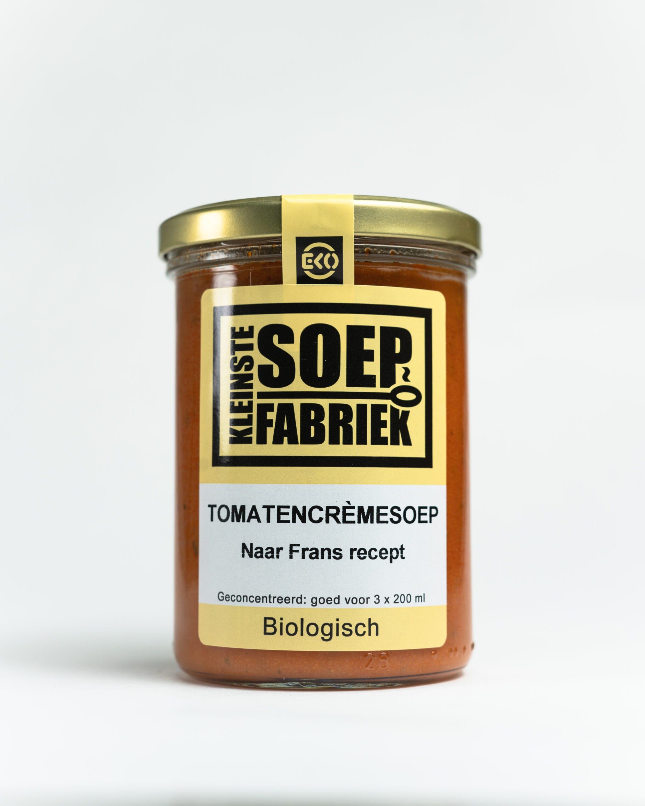 Kleinstesoepfabriek bio tomato cream soup in a 400ml container, featuring vibrant red tomato soup with fresh ingredients.