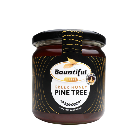 Bountiful Select Griekse raw pine tree honey in a 500g jar, showcasing golden honey with pine tree flavor.