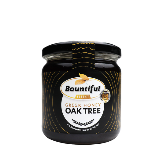 Bountiful Select Griekse raw honey from oak tree, 500g jar, natural golden honey with rich texture and floral aroma.
