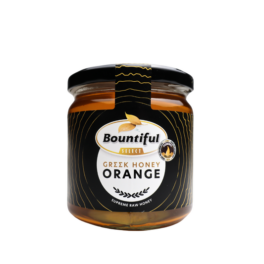 Bountiful Select Griekse rauwe honing met sinaasappel, 500g jar, viscous orange-flavored honey with natural texture