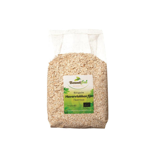 Bountiful fijn bio havervlokken ontbijtgranen in 500g package, close-up of golden oats in a clear bowl