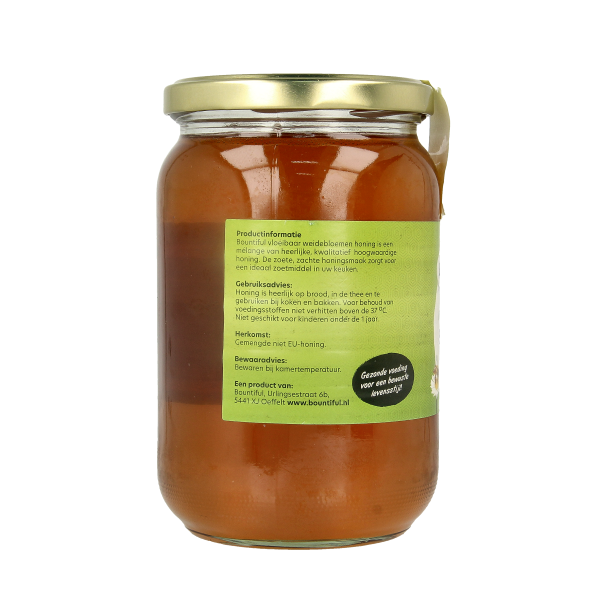 Bountiful Weidebloemen honing in a 900g jar, showcasing golden liquid honey with fresh flower blossoms in the background.