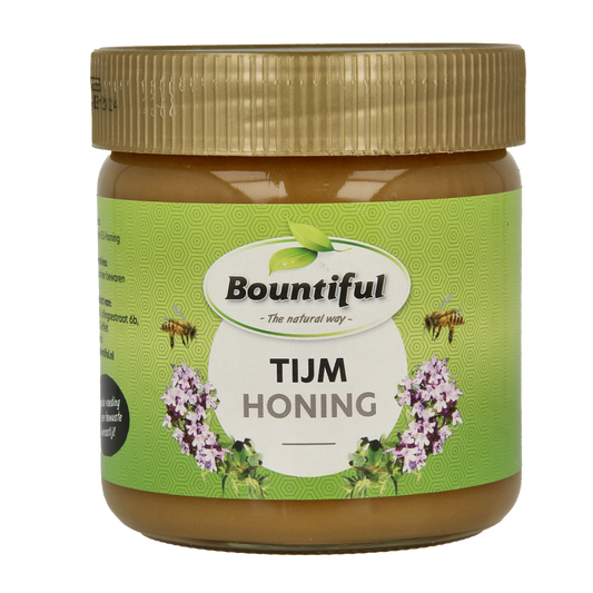 Bountiful Tijm honing in a 500g jar, featuring fresh herbs with vibrant green leaves and a clear label displaying the brand.