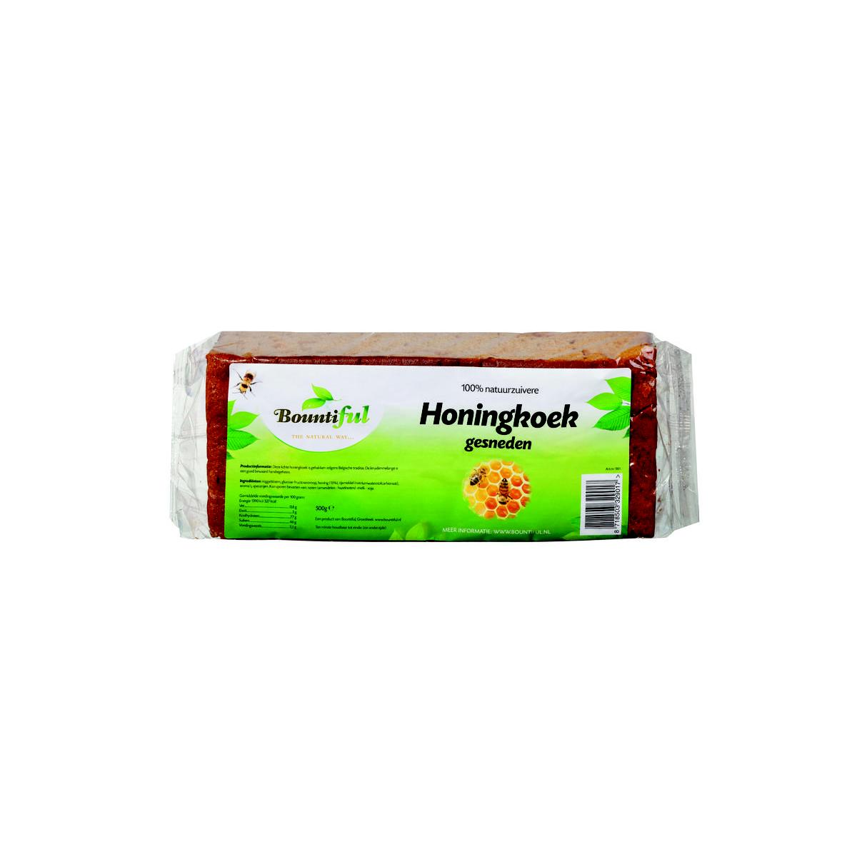 Bountiful Honing ontbijtkoek 500g, a sliced honey-flavored Dutch breakfast cake on a wooden cutting board.