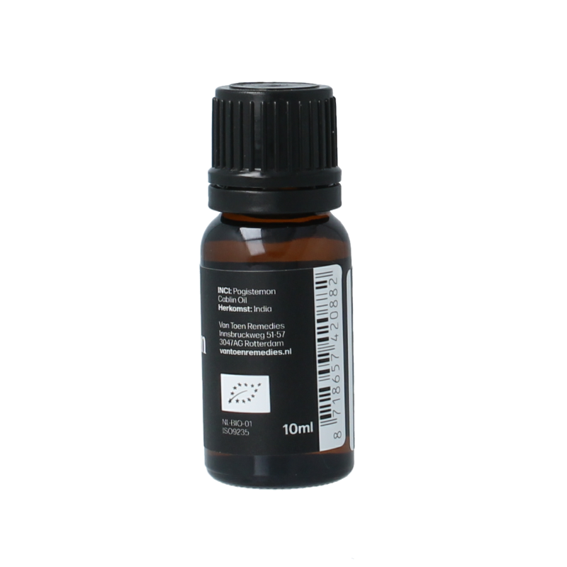 Bottle of Van Toen Patchouli bio essential oil in a 10ml glass container, with a label showing product details.