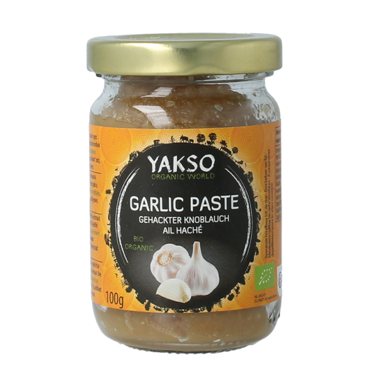 Organic chopped garlic from Yakso in a 100g package, shown in a clear image of the product packaging.