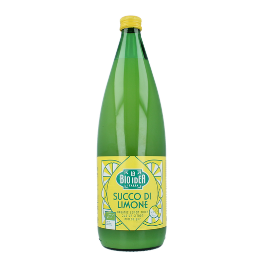 Bioidea organic lemon juice in a 1-liter bottle, showcasing fresh lemon slices and clear liquid in a natural setting.