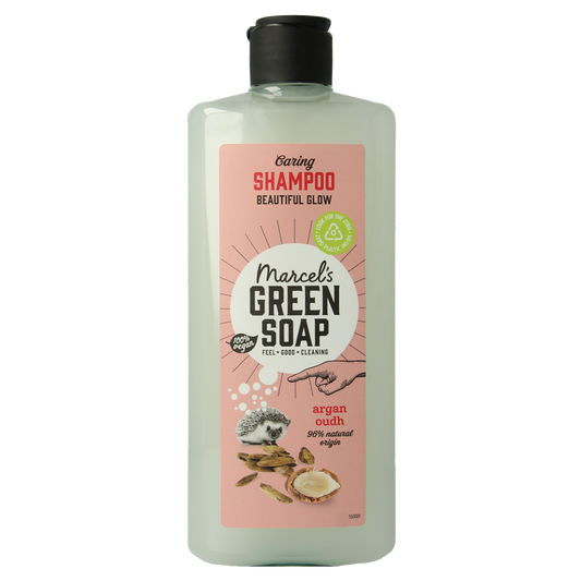 Marcel's Green Soap caring shampoo with argan oil and oudh in a 300ml bottle, features a green and white label, for nourishing hair care.