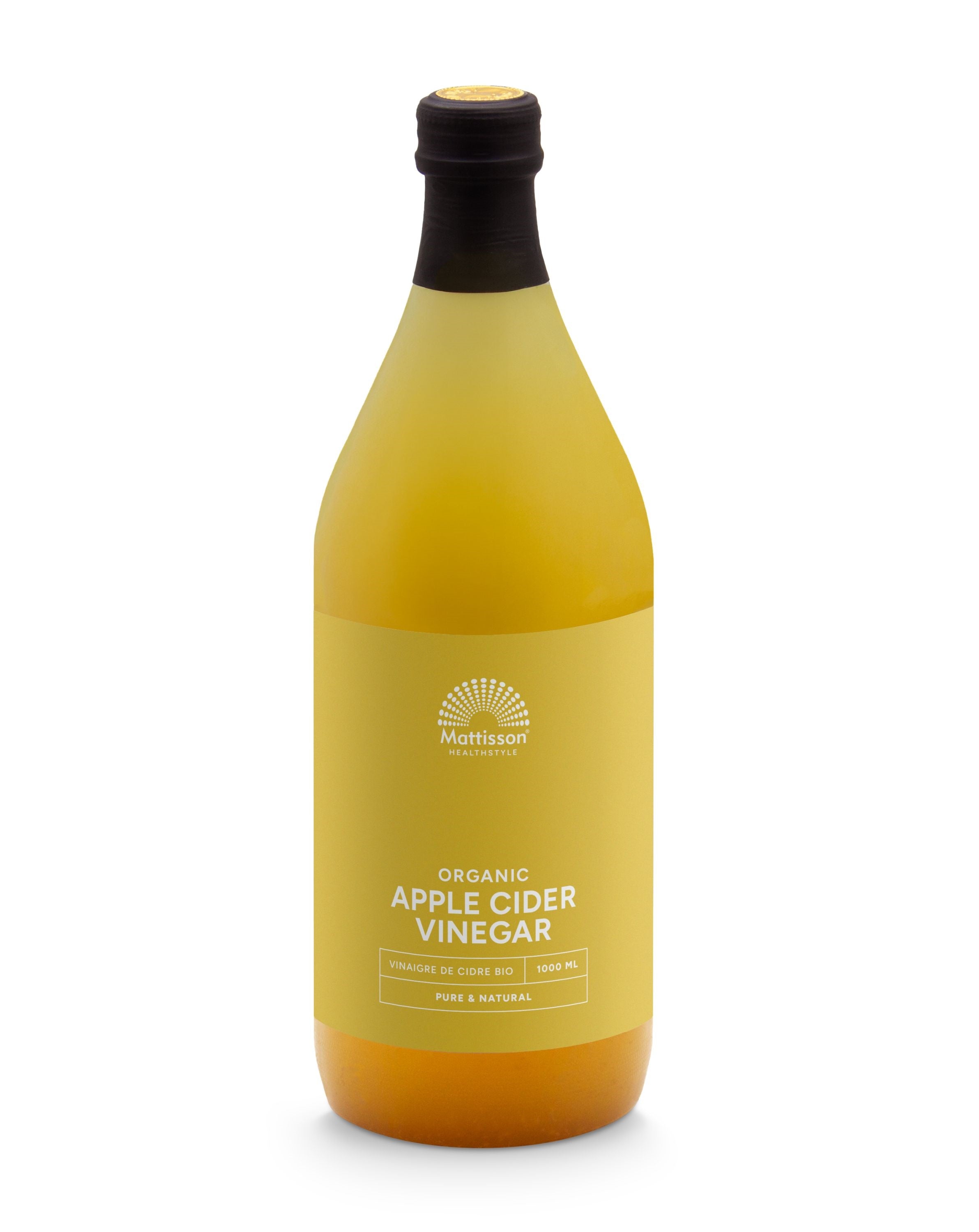 Glass bottle of Mattisson organic apple cider vinegar with a label, 1-liter size, used for drinks and cooking.