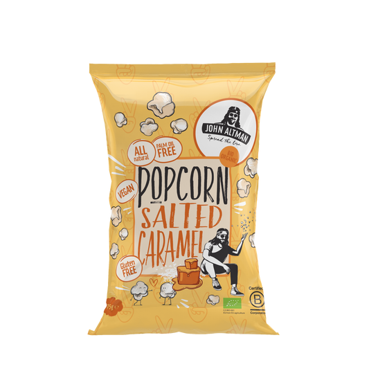 John Altman salted caramel bio popcorn snack in 75g bag, showing golden caramel-coated popcorn pieces.