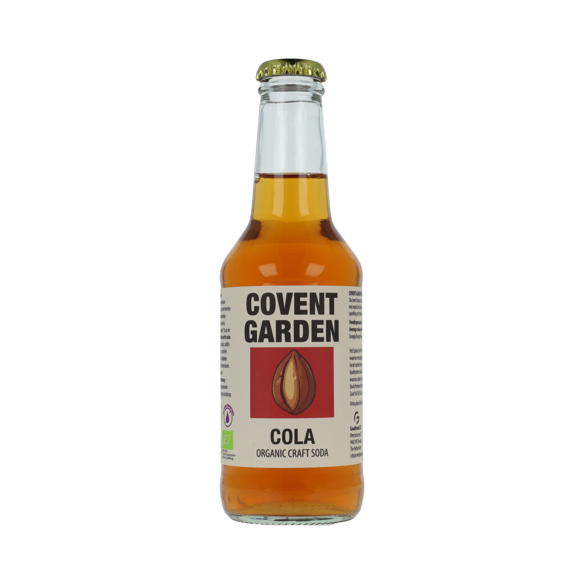 Glass of Covent Garden Cola bio 250ml bottle with dark cola beverage and label, in a natural setting.
