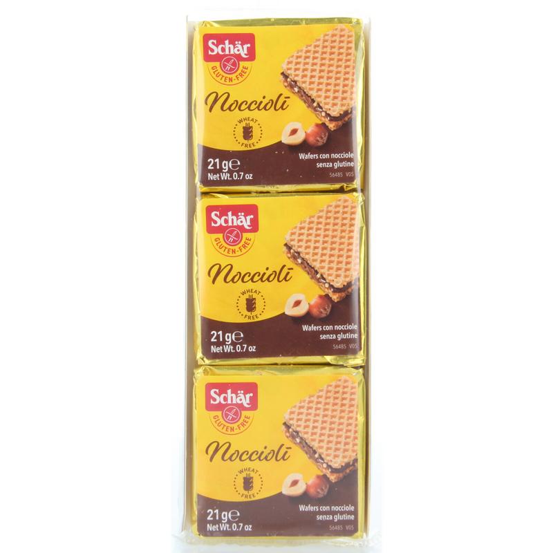 Schar Noccioli gluten-free cookies in 63g package, showing golden-brown hazelnut-flavored koeken with nuts on top.