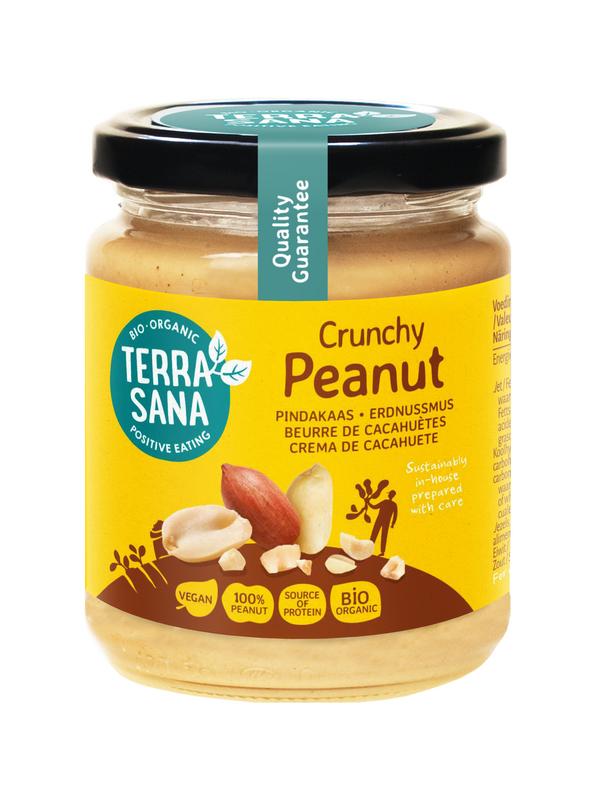 Crunchy organic TerraSana peanut butter spread on bread, without salt, in a 250g jar.