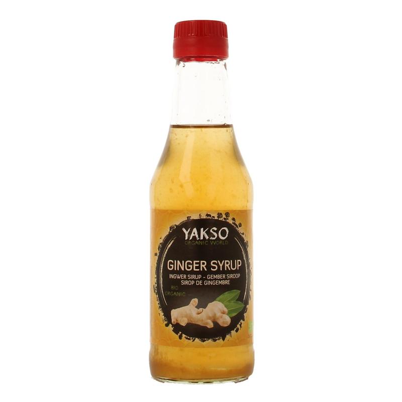 Yakso bio ginger syrup bottle, 240ml, in a clear glass container, showcasing the golden ginger sauce for cooking and flavoring.